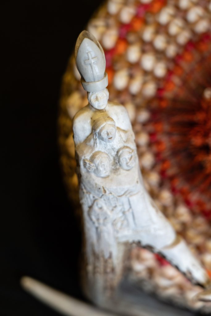 Close up of the Pope silencing the school children antler carving.